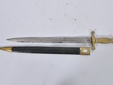 pair of old and worn swords on a white surface