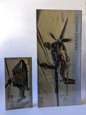 trois livres sur une surface blanche avec l'image d'une girafe sur la couverture