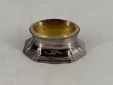 silver plated candle holder on a white surface