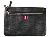 a black purse with a red, white, and blue stripe on it