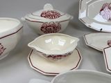 many different types of dishes and bowls on the table