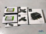 several boxes of electronic devices sitting on top of a table