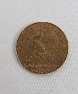 a close up of a gold coin with a bird on it