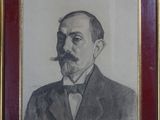 portrait d'un homme en costume, avec une moustache et une barbichette