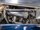 a close up of the engine of a car with its hood open