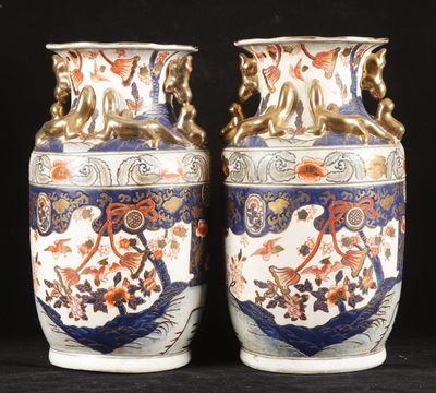 two vases that are sitting on a black surface