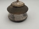 an old wooden box with a lid on a white surface