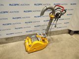 a close up of a machine on the ground near a wall