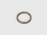 a close up of a ring on a white surface