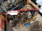 a pile of wires and wires on a pallet in a warehouse