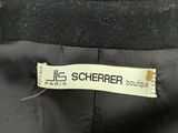the label of a black jacket with the name of the label on it