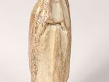 a small statue of a woman with a veil on her head