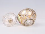 two glass vases sitting next to each other on a white surface