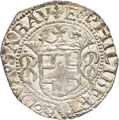 une vieille pièce d'argent sur laquelle figure un blason