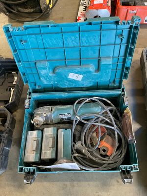 a blue tool box with tools in it on the floor