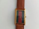 an image of a watch sitting on top of a white table
