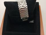 an image of a watch sitting on top of a black case