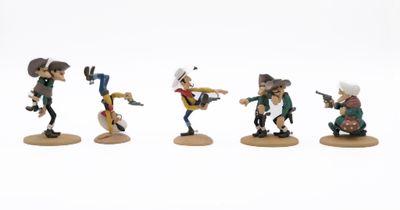 five figurines of people with guns on a white surface
