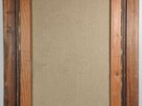 an old picture frame with a picture hanging on a wall