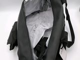 a black bag that is open on a white surface