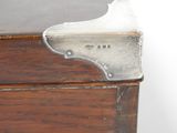 a close up of a piece of wood with a piece of metal on it