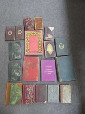 a lot of books that are on the floor