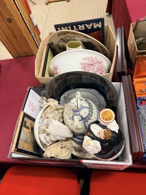 a box full of plates and bowls sitting on a table