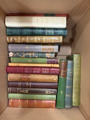 a box full of books sitting on top of each other