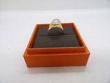 an orange box with a ring inside of it on a white surface