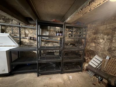 a refrigerator and a refrigerator freezer in a dirty room