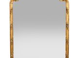 an ornate gold mirror with a white background and a white background