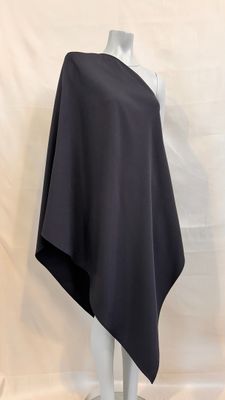a white mannequin with a black cape on top of it