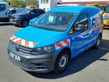 a blue van that is parked in a parking lot