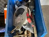 a blue container with tools in it on the floor