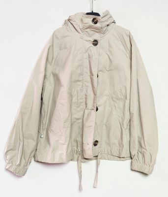 an image of a jacket hanging on a hanger on a wall