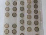 a lot of coins in a plastic bag on a table