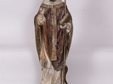 statue of a man dressed in a robe and holding a staff
