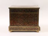 an old wooden chest with a marble top and ornate carvings