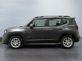 the jeep renegade is parked in a grey room with a gray floor