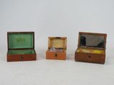 three small wooden boxes that are sitting next to each other