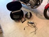 a motorcycle that is sitting on the floor next to a motorcycle