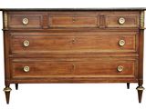 a wooden chest of drawers with brass handles and a marble top
