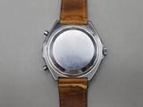 an image of a close up of a wrist watch on a table