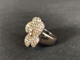 a close up of a ring with a flower on it