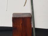 a small wooden box with a baseball bat on it
