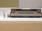a toy train that is in a box on a table