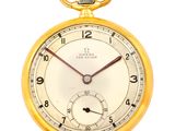 an old yellow pocket watch on a white background with a red second hand