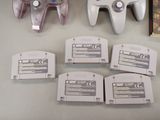 four game controllers sitting next to each other on a table