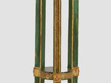 a green and gold table with a marble top