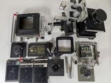 a lot of old cameras and other items on the table